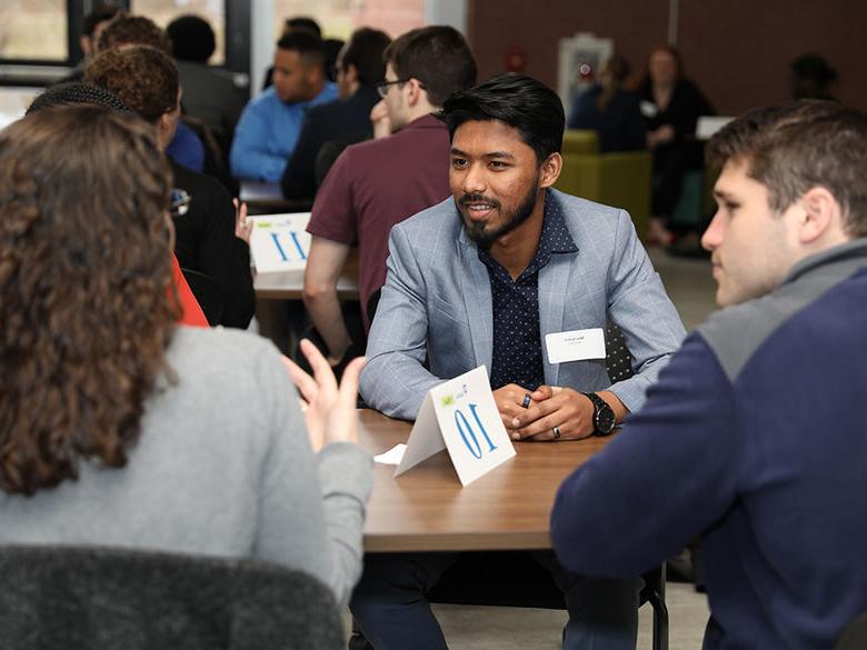 Students networking at career event.